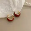 Pendientes de piedra ojo de gato rombo geométrico de diseño de nicho temperamental pendientes de moda para redes sociales con temperamento versátiles que adelgazan el rostro