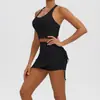 Novedad transfronteriza: Conjunto de yoga de minifalda plisada con cordón de color liso, top deportivo, conjunto de dos piezas para mujer para correr y fitness