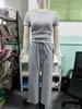 2026 Amazon estilo europeo y americano simple cuello redondo manga corta cordón pierna ancha pantalones casual conjunto de dos piezas para mujer en stock