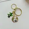Llavero de aleación de panda de dibujos animados al por mayor, colgante pequeño, hoja de bambú, hebilla de resorte, pequeño accesorio colgante para bolso
