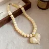 Collar de doble capa con cuentas acrílicas transfronterizo europeo y americano, cadena para la clavícula de lujo ligero de alta gama, joyería de estilo étnico vintage al por mayor