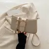 Bolsa Feminina Popular de Comércio Exterior Versátil Bolsa de Ombro 2026 Verão Simples Bolsa de Mão Cor Sólida Textura Estilosa PU Bolsa de Ombro Único