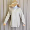 Foto real de cárdigan de punto para mujer de otoño coreano, moderno 2020 nueva moda femenina adelgazante cuello en V tejido abrigo talla grande