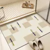 Alfombrilla de suelo para baño estilo crema transfronteriza al por mayor absorción de agua secado rápido resistente a la suciedad antideslizante cojín de tierra de diatomeas alfombrilla para pies