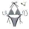 Traje de baño de dos piezas a rayas con cuello halter, estilo nuevo 2026, marca independiente para mujer, bikini sexy de amarre para playa y aguas termales