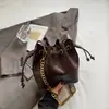 Bolso de Cadena con Rejilla de Diamantes para Mujer 2026 Nuevo Estilo Maillard Sensación de Alta Gama Bolso de Hombro Único Súper Caliente para el Trabajo Cruzado Bolso Cubo