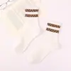 Calcetines de tubo medio para mujer estampado clásico de leopardo calcetines altos para niños otoño e invierno vintage versátiles estilo coreano calcetines para mujer cálidos transpirables