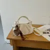 Bolsa feminina de nicho transfronteiriça, casual e única, nova tendência moda outono 2026, bolsa simples de ombro e transversal