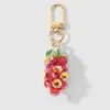 Nuevo Ins Dulce y Exquisito de Alta Apariencia Hermanas Cristal Imitación Perlas Fresa Uva Llavero DIY Colgante de Bolso