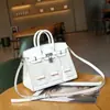 2023 Nova bolsa pequena de couro com estampa de palma e padrão de crocodilo, combinação de cores, casa pequena, bolsa Platinum, moda, portátil, transversal, bolsa feminina