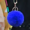 Al por mayor en stock Bola de pelo de imitación de conejo Rex de 8 cm llavero colgante lindo para mujer bolso de coche teléfono móvil colgante de felpa