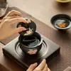 Cerámica negra, tinta plana, diseño de lirio, pintura al agua pura, tapa ribeteada en oro, cuenco de té de gran capacidad, cuenco con infusor de té, juego de té de cerámica, cuenco de té