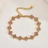 Pulsera de trébol de cuatro hojas estilo francés transfronteriza europea y americana, lujo ligero con un toque de alta gama, llena de piedras de circonita, joyería de acero inoxidable