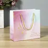 En stock bolsa de regalo al por mayor ropa cosméticos bolsa de regalo navideño bolsa de embalaje simple logo imprimible bolsa tote creativa