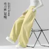 Calça feminina amarela clara de perna curva estilo primavera e outono 2026 nova solta com caimento estilo preguiçoso para baixinhas calça de perna larga