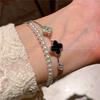Pulsera de trébol de cuatro hojas dulce de flor micro-incrustada de doble capa 2024 para enviar pulsera de novias joyería nicho joyería para mujer