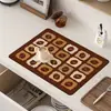 Servicios de etiquetado y envío transfronterizo TEMU para tapetes para máquinas de café, tapetes absorbentes de tierra de diatomeas de secado rápido para escurrir la cocina y posavasos aislantes del calor para escritorio