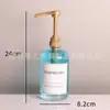 Botella de vidrio para desinfectante de manos al por mayor botella de loción negra con cabezal de bomba de presión larga botella dispensadora de jabón transfronteriza