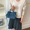Bolso retro de nicho para mujer, nuevo modelo 2026, bolso cruzado sencillo para el día a día, bolso tipo cubo versátil y moderno para el uso casual