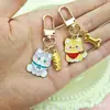 Llavero Creativo Estilo Japonés Pez Gato Hueso de Cachorro Accesorios de Aleación con Goteo de Aceite Colgante Decorativo de Bolsa de Dibujos Animados Lindo