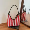 Bolsa de Mão Feminina 2026 Nova Moda Listrada Bolsa Tote de Ombro Casual Trançada Nicho para o Dia a Dia Tendência