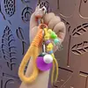 Serie Miu Creativa Hebilla de Cuerda de Mano Corazón Tenis de Mesa Colgante Lindo Pareja Llavero de Coche Colgante de Bolso Regalo