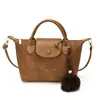 Bolsa de mano tejida de alta calidad transfronteriza, nueva colección otoño 2026 para mujer, un bolso de hombro súper popular y versátil para ir al trabajo