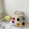 Ins hecho a mano tejido de ganchillo bola de pelo colorida para niños niña bolso de mano portátil accesorios bolsa para monedas de móvil venta al por mayor