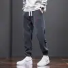 Pantalones casuales engrosados para hombre, nuevos pantalones deportivos tipo jogger de pana cálida para hombre con retazos, modernos y versátiles