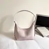 Bolso de axila de nicho de alta gama para mujer, nuevo modelo 2026, bolso tipo cubo de color liso, bolso de hombro suave, bolso para el día a día
