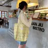 Bolsa de mano de algodón floral estilo coreano, un bolso versátil y elegante que se puede llevar en la mano o colgar al hombro, perfecto para estudiantes mujeres, ligero y con gran capacidad, ideal para llevar libros a clase