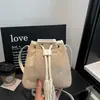 Bolsa de cordón suelta para mujer, nuevo estilo otoño 2026, bolso de mano de moda, bolso de hombro, bolso cubo retro para ir al trabajo, bandolera