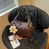 Bolso de mano de comercio exterior, bolsa de bolos, bolso de mujer coreano, moda nueva primavera-verano 2026, sensación de alta gama, bolso de gran capacidad para el hombro