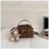 Bolsa de mão de moda retrô para mulheres, nova coleção de outono 2026, bolsa transversal com laço texturizado, bolsa de mão pequena estilo coreano