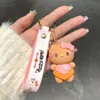 Lindo llavero de Sanrio con colgante de muñeco de dibujos animados para coche, accesorios para bolso, adornos colgantes, pequeño regalo al por mayor