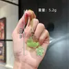 Boneca Criativa Fofa Sapo Verde Luminoso Chaveiro de Sapo Pingente para Celular Pingente de Flor Pequena para Carro Pingente de Bolsa