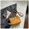 Bolso cubo tejido de alta gama transfronterizo para mujer, nuevo bolso cruzado versátil de moda 2026, bolso de mano y bolso de hombro simples