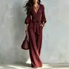 Mono de otoño estilo francés con cuello en V, pantalón de pierna ancha, mangas abullonadas, cinturón de corbata, cintura alta, adelgazante, mono de longitud larga