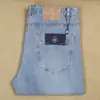 Nuevos jeans de moda para hombre de primavera y verano, rectos, ajustados, blancos, azul claro, lyocell, poliéster, algodón elástico