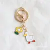 Chaveiro Personalizado de Patinho Fofo com Flores Acessórios Pingente de Bolsa de Patinho Animado Chaveiro de Desenho Animado