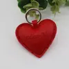 Venta al por mayor transfronteriza de colgantes creativos personalizados, accesorios de cuero PU con forma de corazón de cachorro, accesorios para llavero de bolso, materiales para manualidades