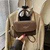 Bolsa Quadrada Pequena de Mola Estilo Hong Kong Ombro Único 2026 Nova Tendência Design de Nicho Moda Cor Sólida Bolsa Transversal de Alta Qualidade