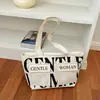 Bolsa tote de gran capacidad, nuevo estilo para mujer, diseño transfronterizo, lona con estampados, moderna y casual, que irradia un ambiente relajado y elegante