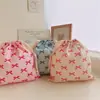 Bolsa de tela de algodón con cordón y estampado de lazo bolsa de almacenamiento para viajes clasificación en casa bolsa de algodón al por mayor