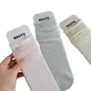 26 Calcetines Nuevos de Primavera Estilo Coreano Borde Enrollado Abotonados Calcetines de Media Pantorrilla para Mujer Versátiles Estilo Miu Puño Suelto Calcetines Arrugados Sin Costuras