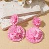 Aretes de isla hechos a mano de girasol de rafia y pasto, aretes de flores grandes exagerados de personalidad junto al mar, venta al por mayor de aretes