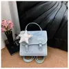 Mochila Estrela 2026 Feminina Nova Tendência Fashion Bolsa de Mão Estudante Viagem Mini Mochila Bolsa Cambridge Feminina