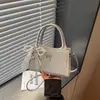 Bolsa Pequeña Versátil de Alta Gama para Primavera Transfronteriza 2026 Bolso de Hombro para Mujer Bolso Cruzado Tipo Cubo Popular