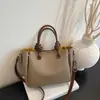 Bolso de mano de alta gama para mujer 2026 nuevo de moda versátil bandolera para el día a día bolso tipo cubo cruzado