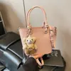 Bolso Cubo Portátil de Color Sólido Simple para Mujer 2025 Primavera Nuevo Moderno Casual Versátil para el Día a Día Bolso de Hombro Cruzado